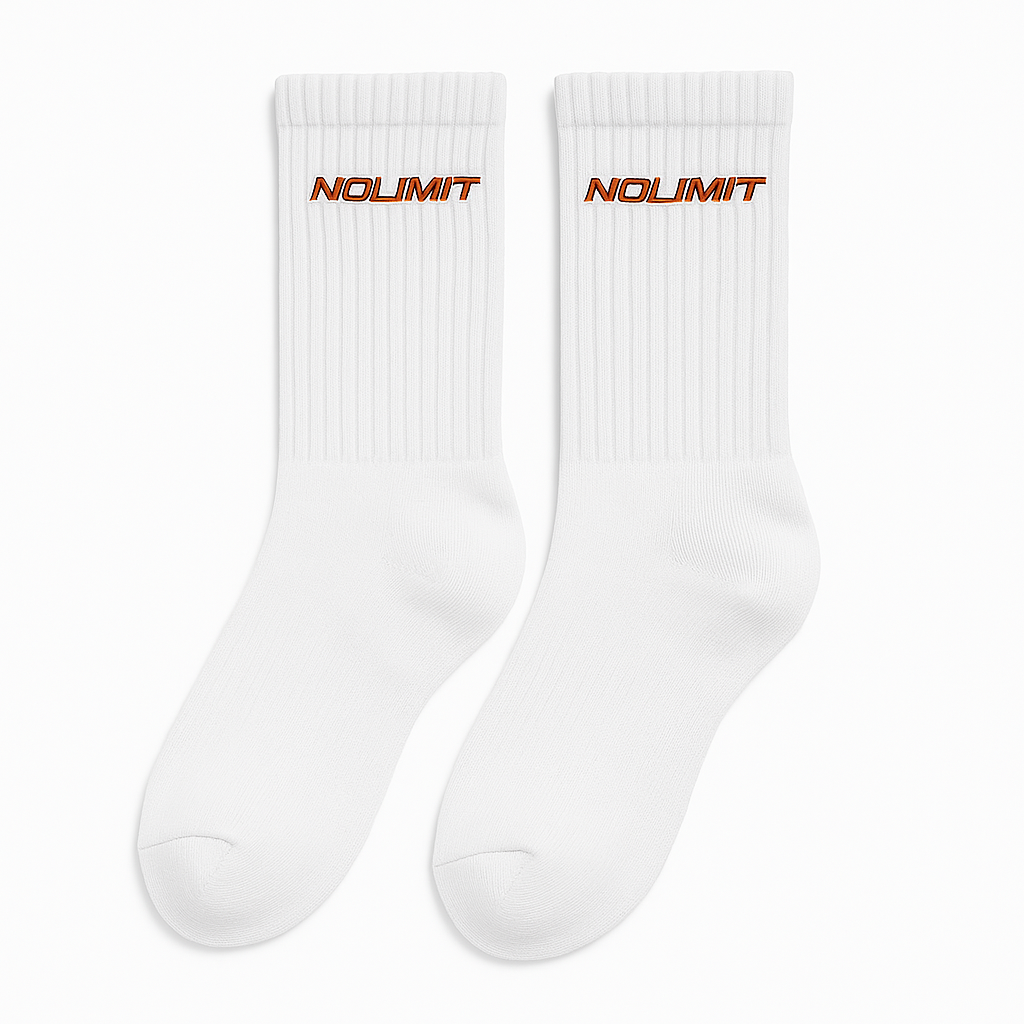 Pair of white NoLimit socks with orange NoLimit embroidery near the ribbed cuff.